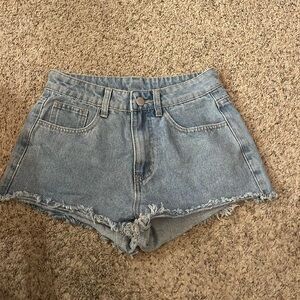 Shorts with sun and moon print on back pockets